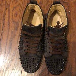 Men spiked all over Louboutin sneakers